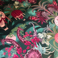 Colourful Designer Fabric with Safari Animals in Emerald Green for Maximalist Home Decor