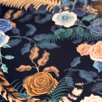 Close up of Bengal Rose Garden velvet fabric with dark blue and floral print by Becca Who
